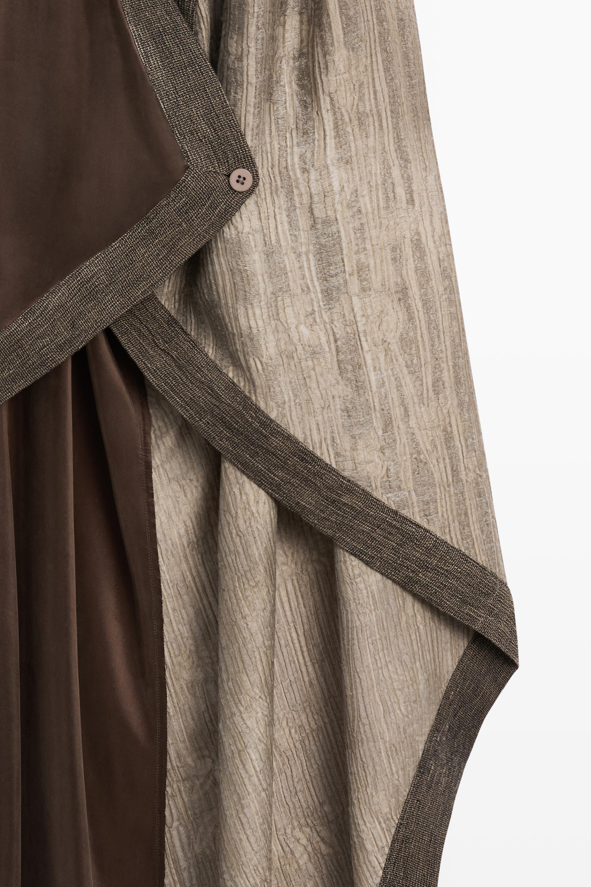 Flowing wrap top with mixed fabric detail